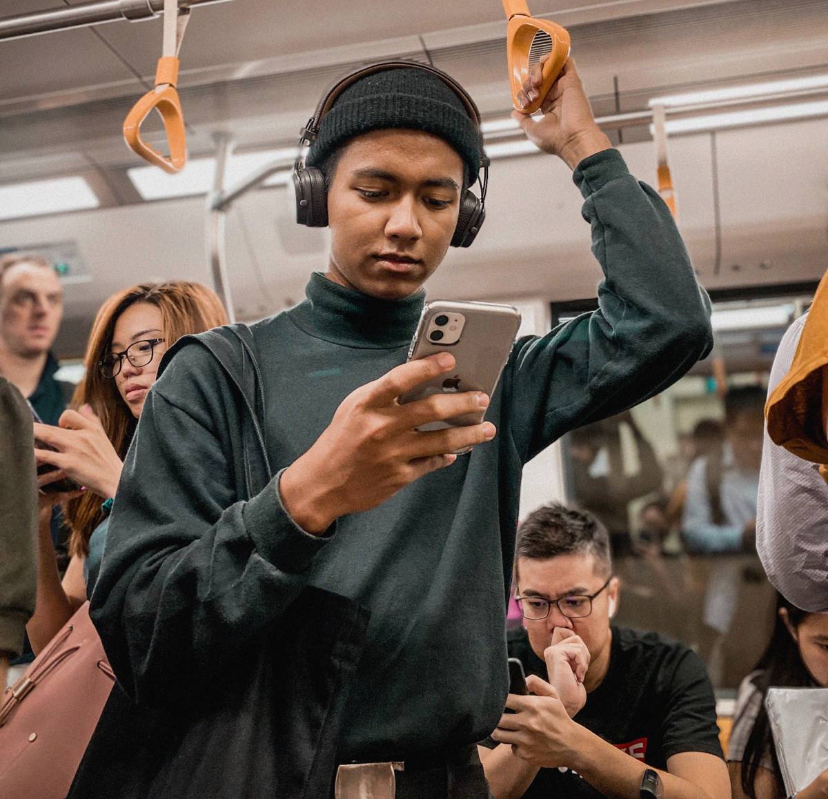 Man using SMS on train